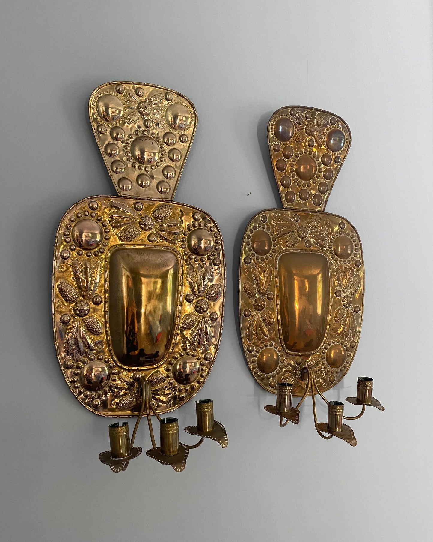 Pair of three - armed brass wall sconces