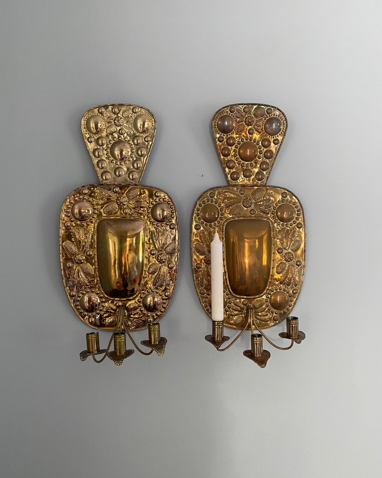 Pair of three - armed brass wall sconces