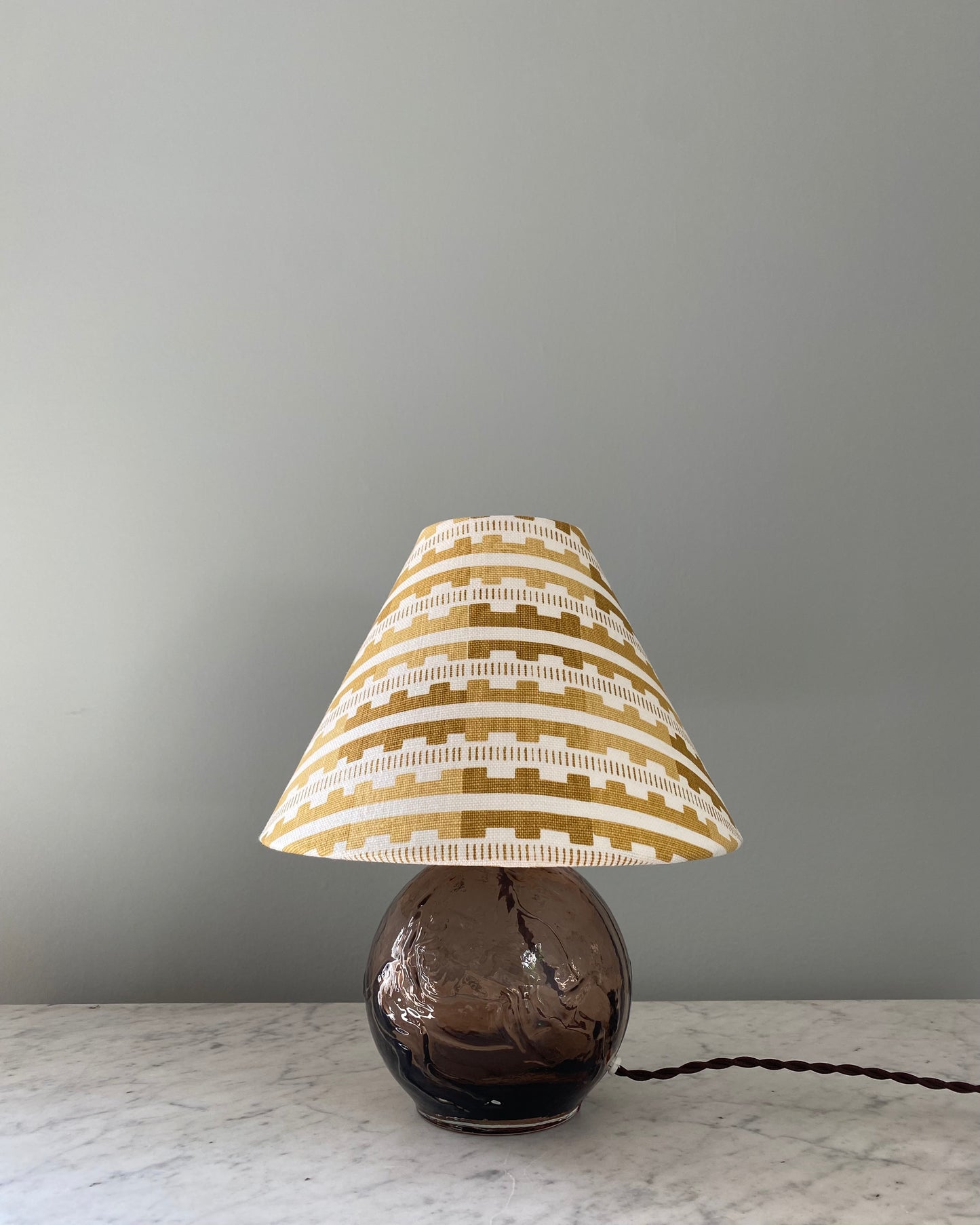 Brown glass table lamp with shade from Cathy Nordström
