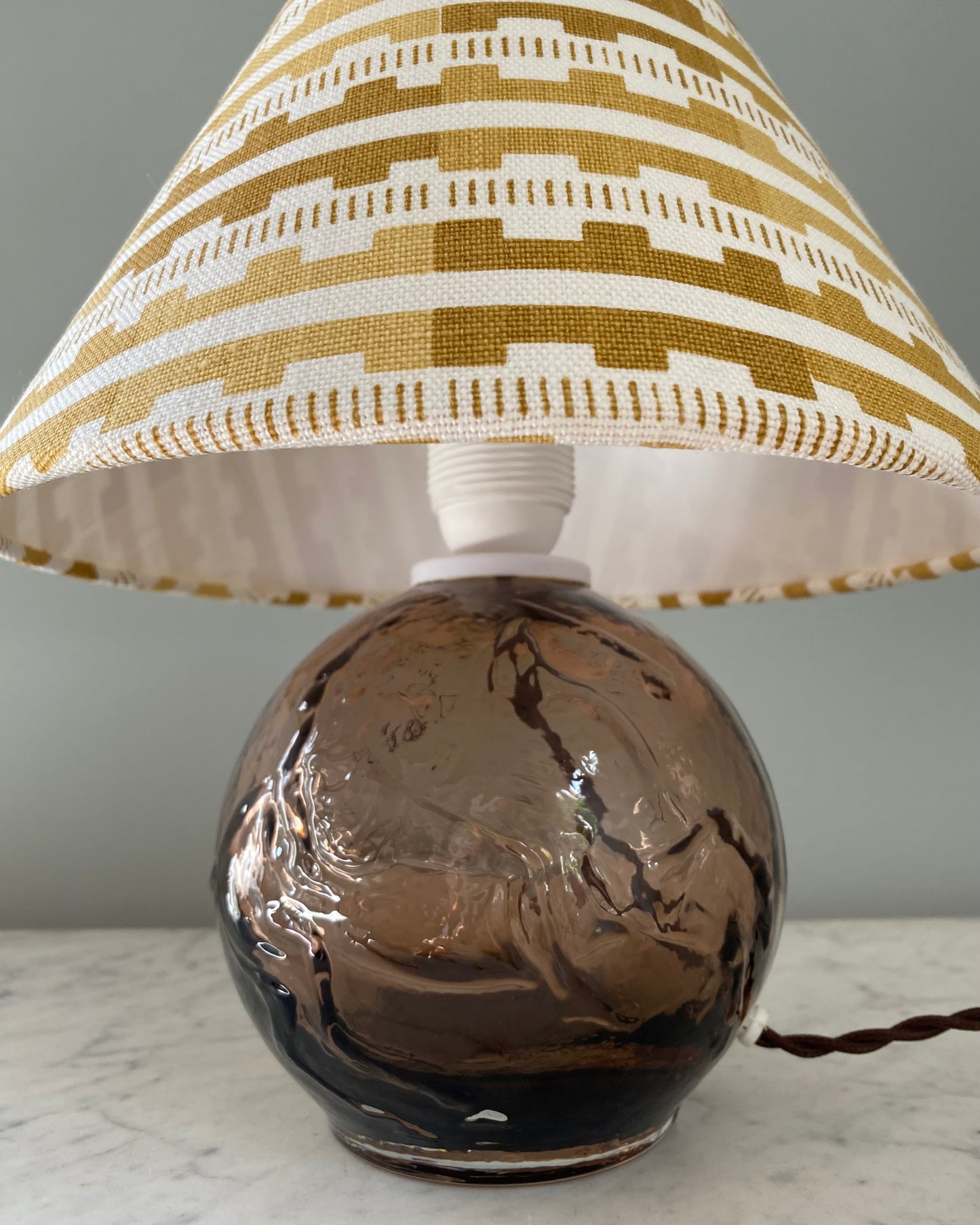 Brown glass table lamp with shade from Cathy Nordström