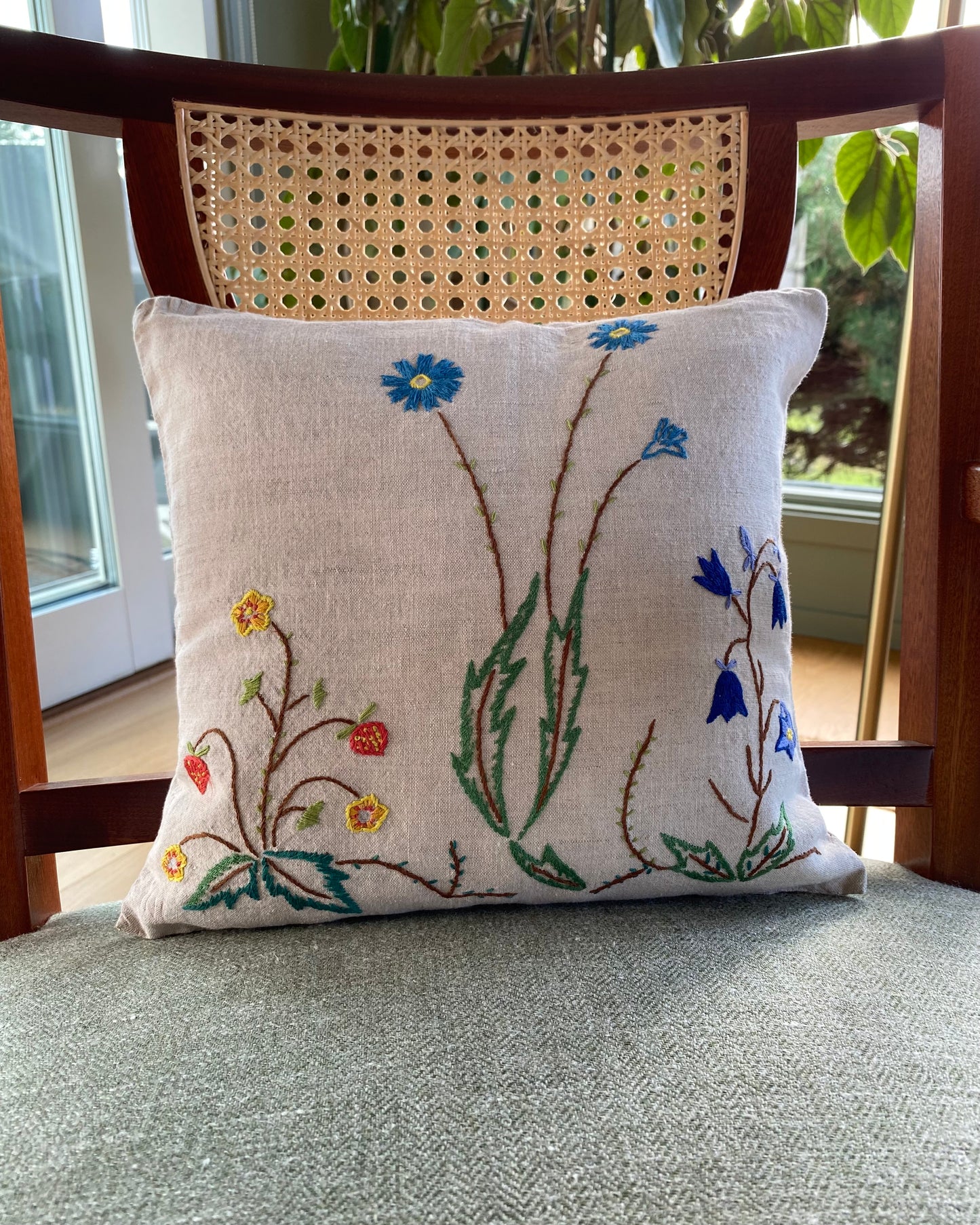 Two hand embroidered cushions