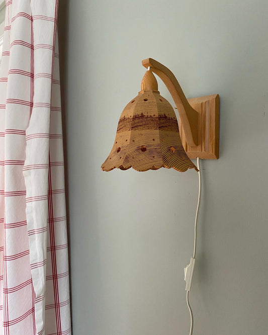 A pair of vintage wooden hanging wall lights