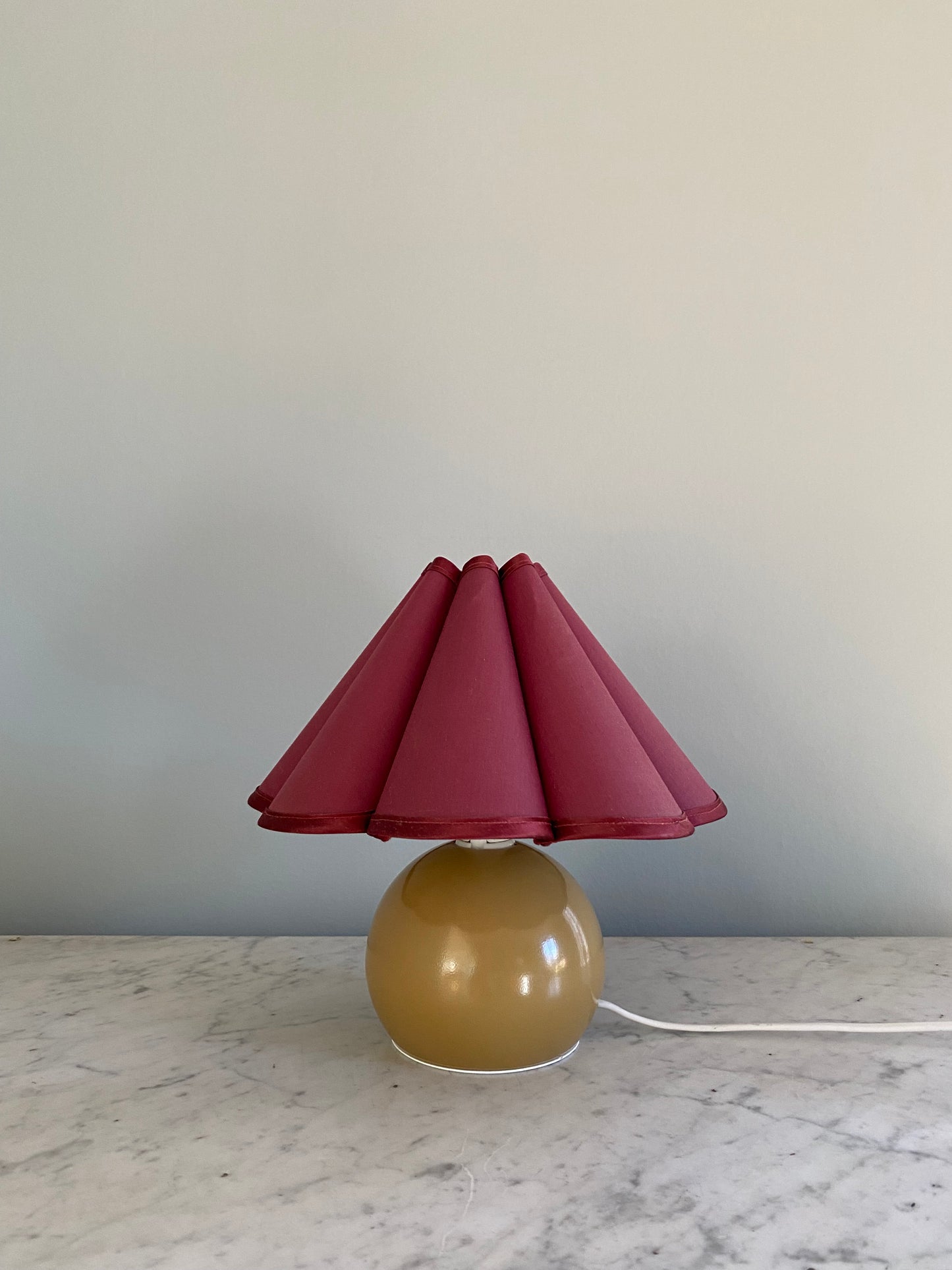 Decorative lamp with a vintage burgundy shade