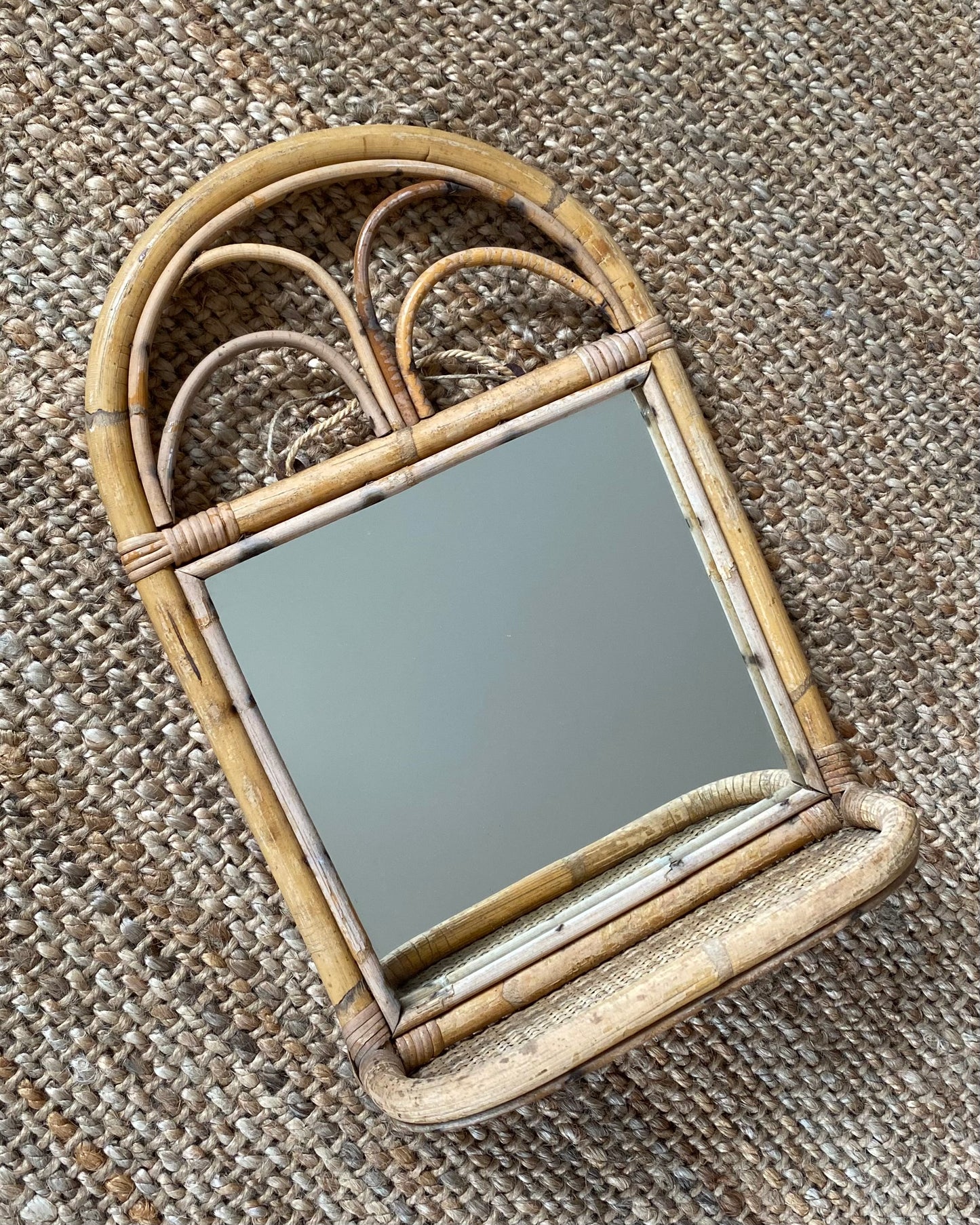 Vintage mirror with rattan shelf