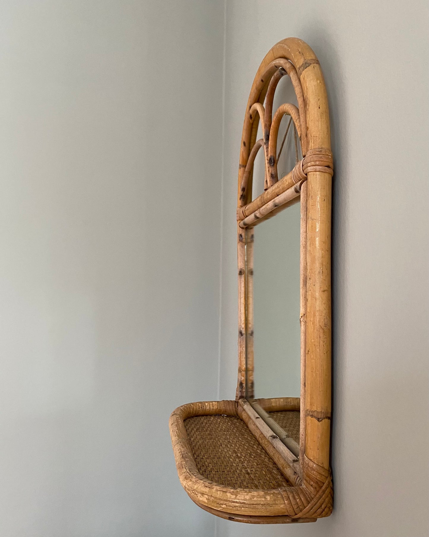 Vintage mirror with rattan shelf
